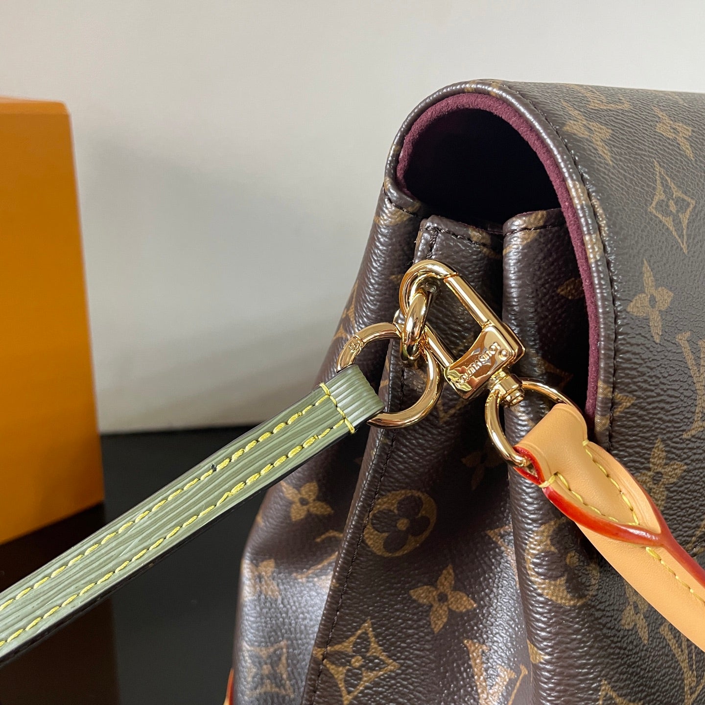 Classic Louis Vuitton Monogram Canvas Handbag With Lock Detail And Stylish Design