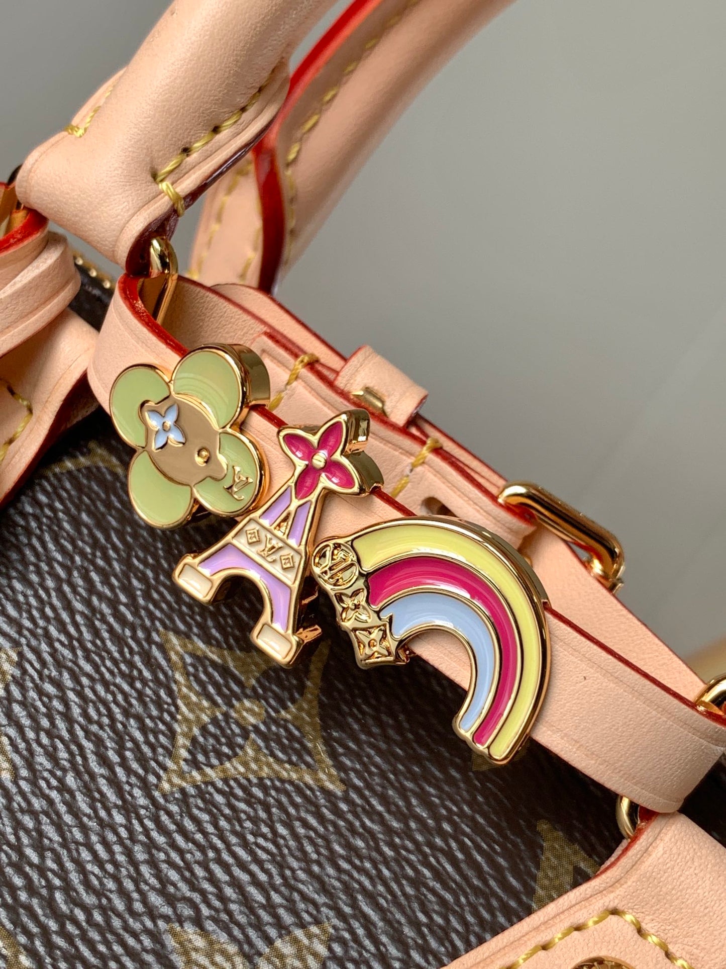 Louis Vuitton Speedy Bandoulière Bag With Colorful Charms And Stylish Strap For Fashion Enthusiasts