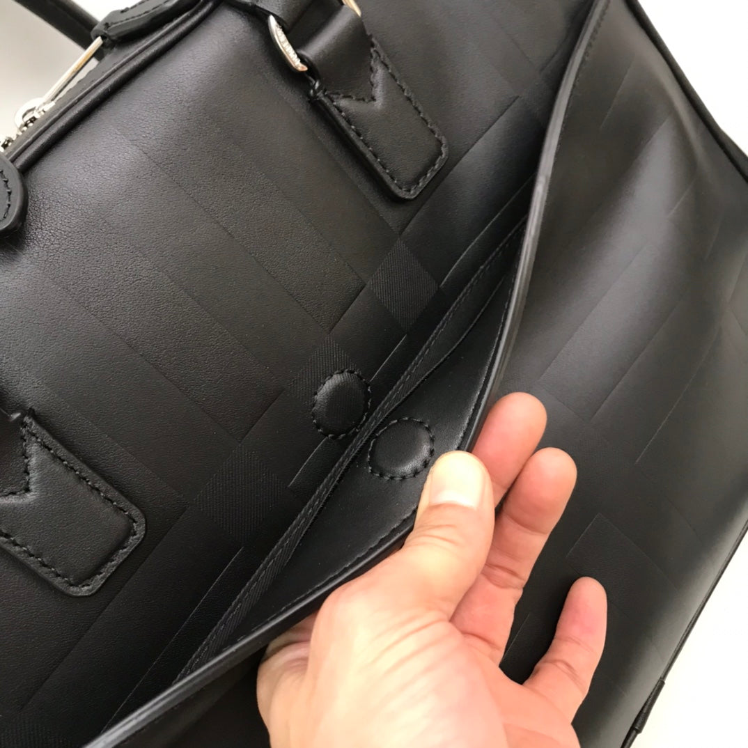 Sleek Black Burberry Briefcase With Woven Texture For Sophisticated Business And Travel Looks