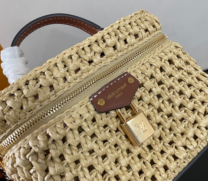 Chic Louis Vuitton Woven Straw Vanity Bag With Leather Handle And Lock Accents