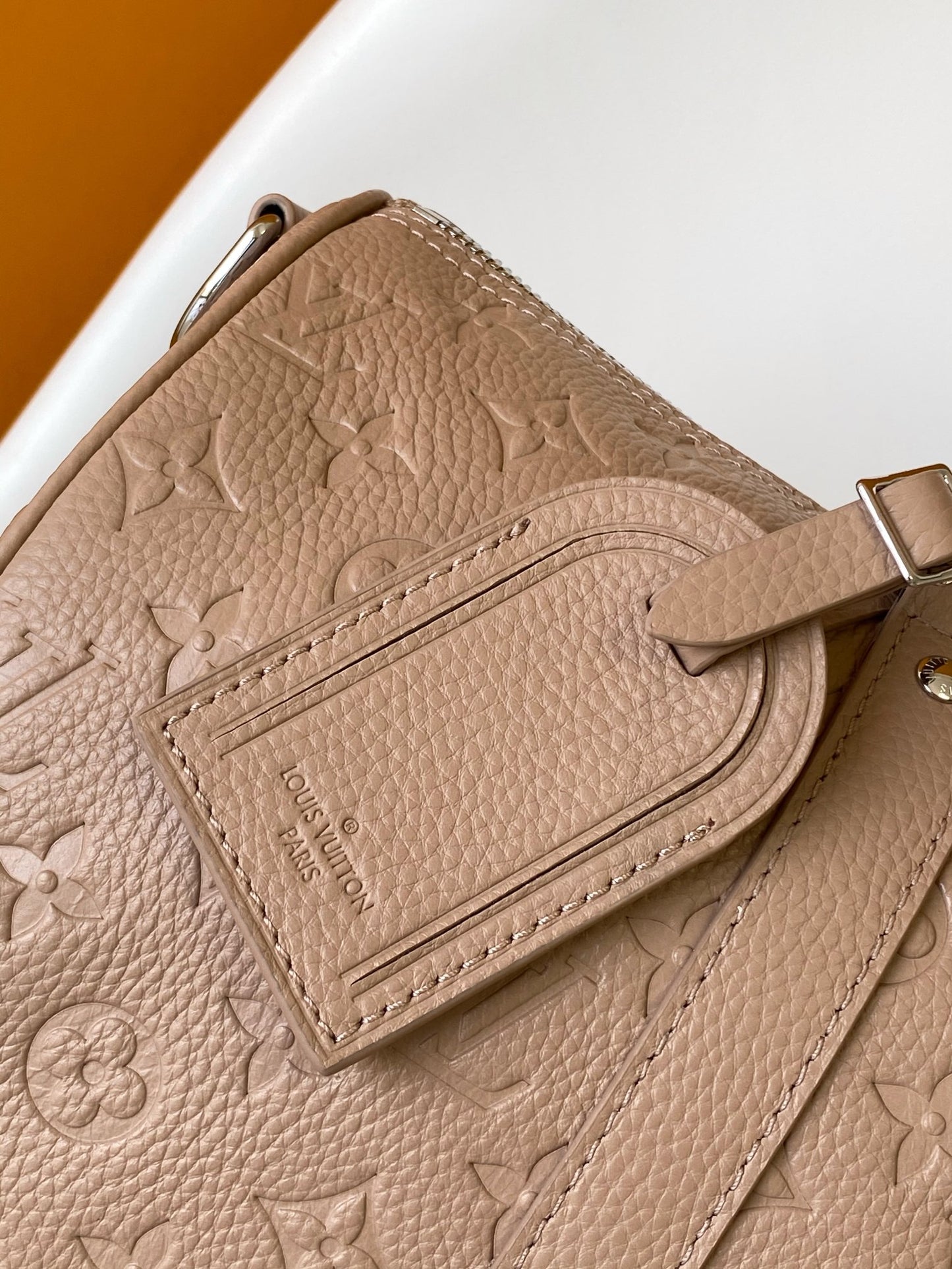 Louis Vuitton Embossed Leather Keepall Bandoulière Bag in Beige for Luxury Travel and Style