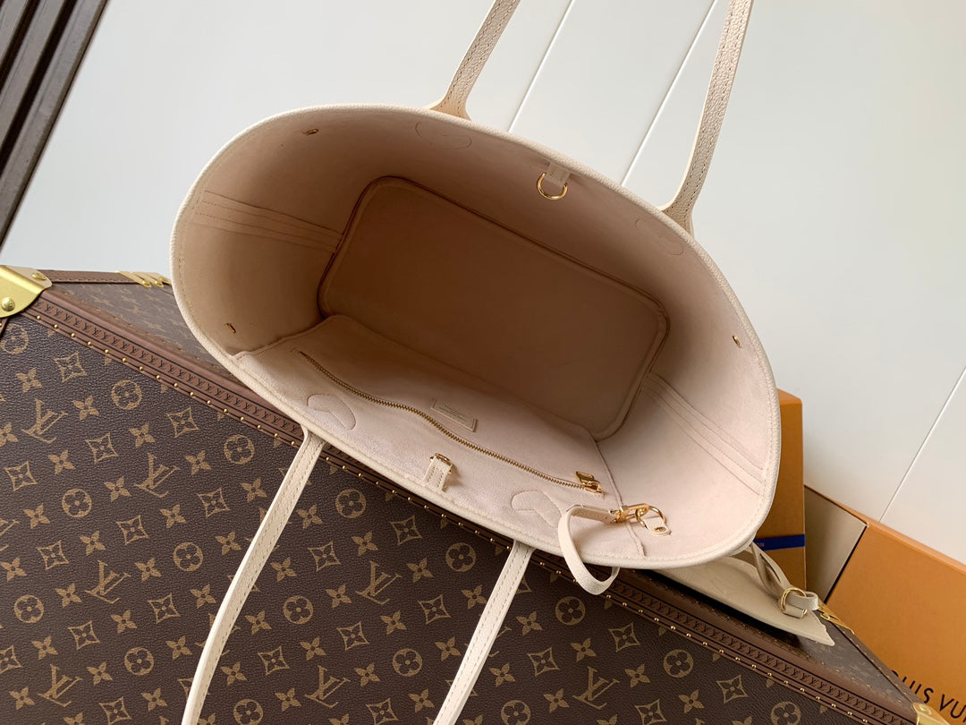 Elegant Louis Vuitton Cream Empreinte Leather Neverfull Tote Bag for Fashion Enthusiasts