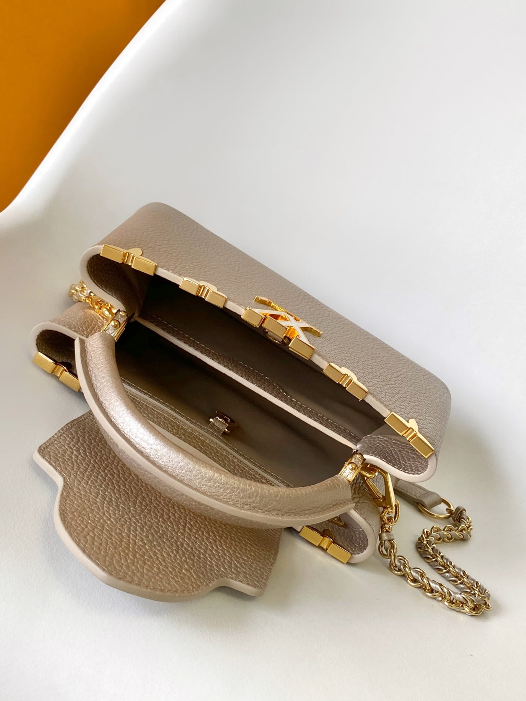 Elegant Louis Vuitton Capucines Mini Bag in Beige Grained Leather with Gold Accents
