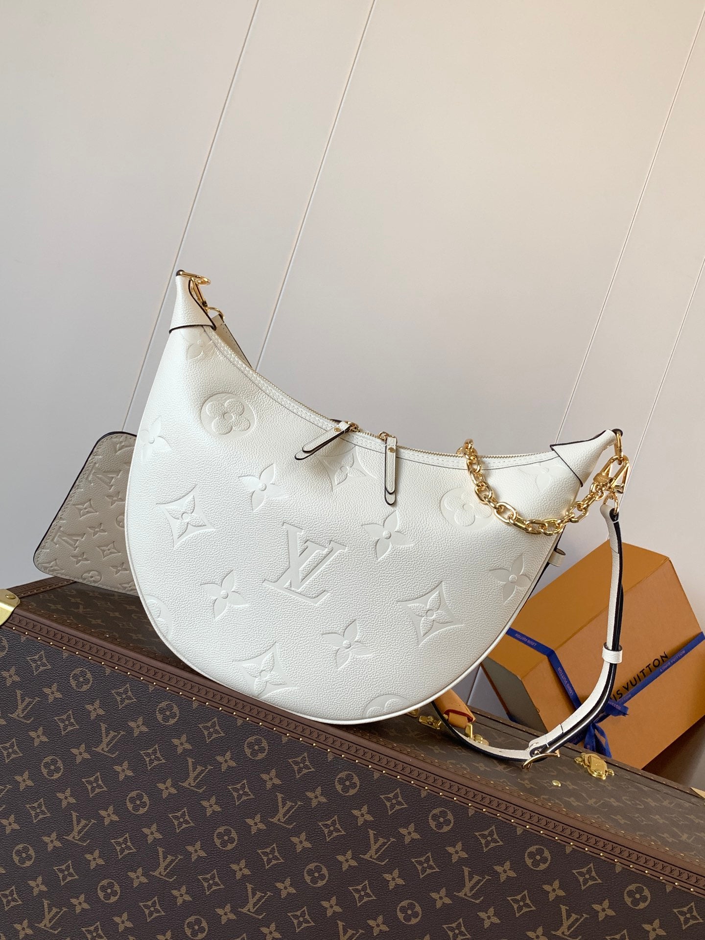Louis Vuitton Black Embossed Leather Moon Bag With Gold Chain Stylish Luxury Shoulder Accessory