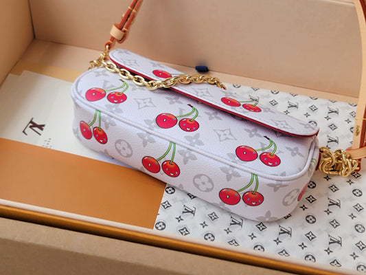 Stylish Louis Vuitton Cherry - Printed Bag With Gold Chain For Fashion Enthusiasts