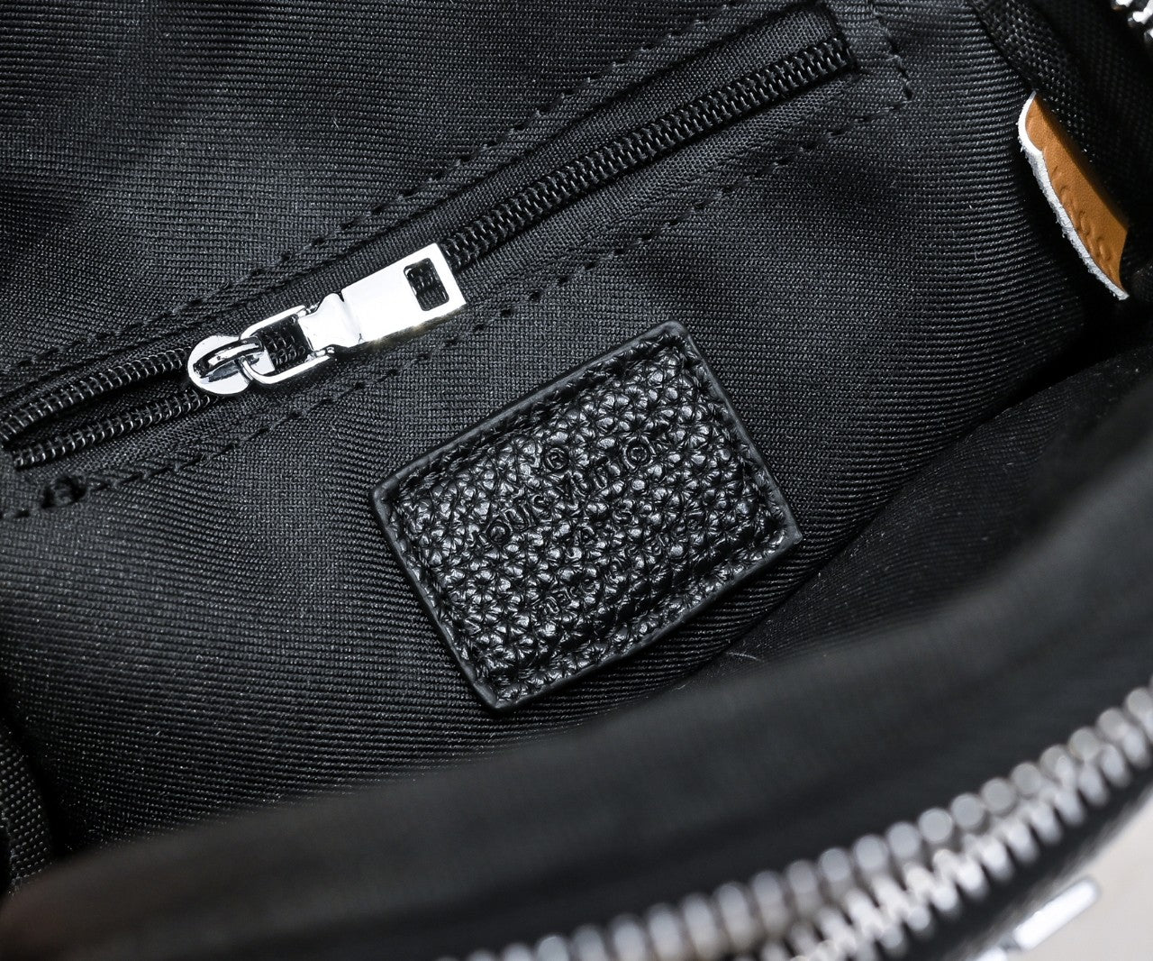 Luxury Louis Vuitton Black Leather Sling Bag with Signature Logo and Stylish Design