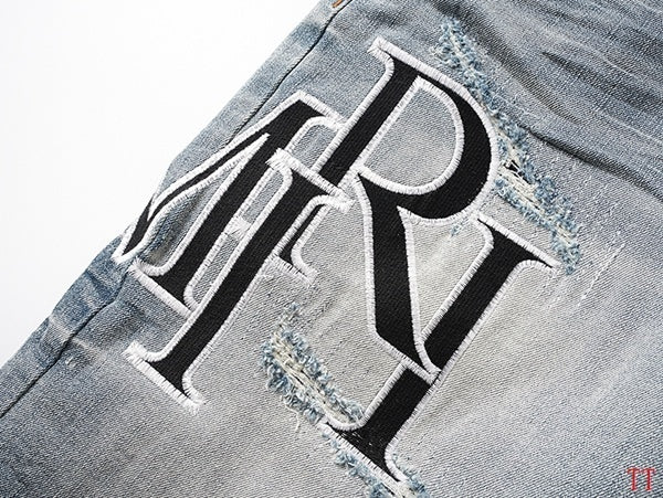 Amiri Light Blue Distressed Denim Shorts With Stylish Logo