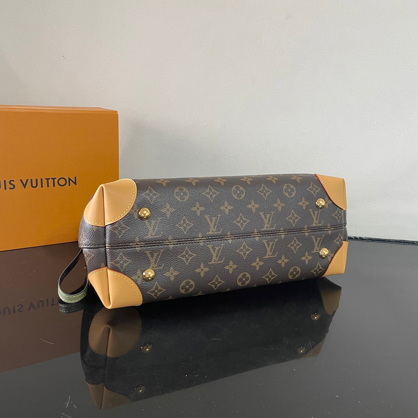 Classic Louis Vuitton Monogram Canvas Handbag With Lock Detail And Stylish Design