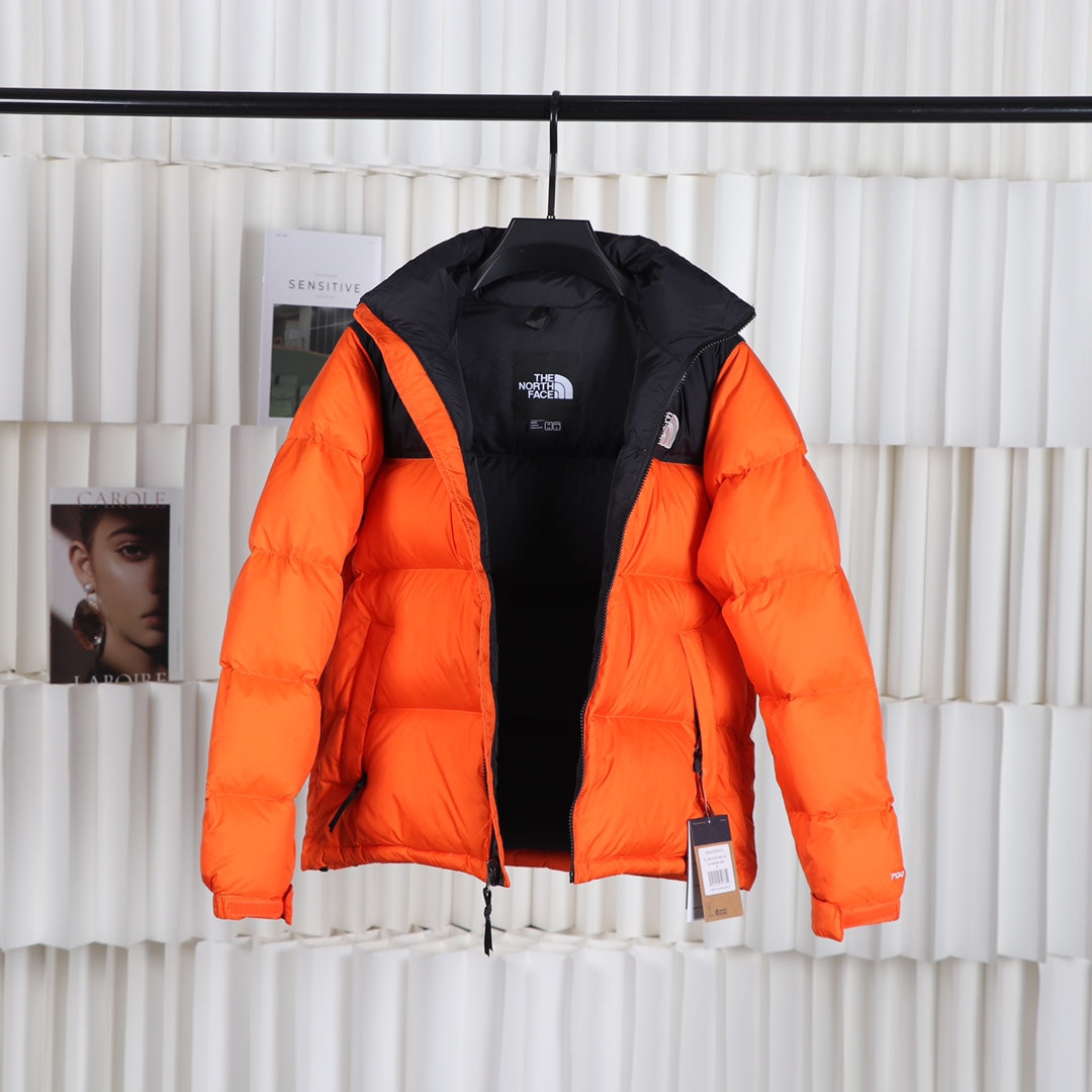 The North Face 1996 Retro Nuptse Orange Puffer Jacket for Cold Weather