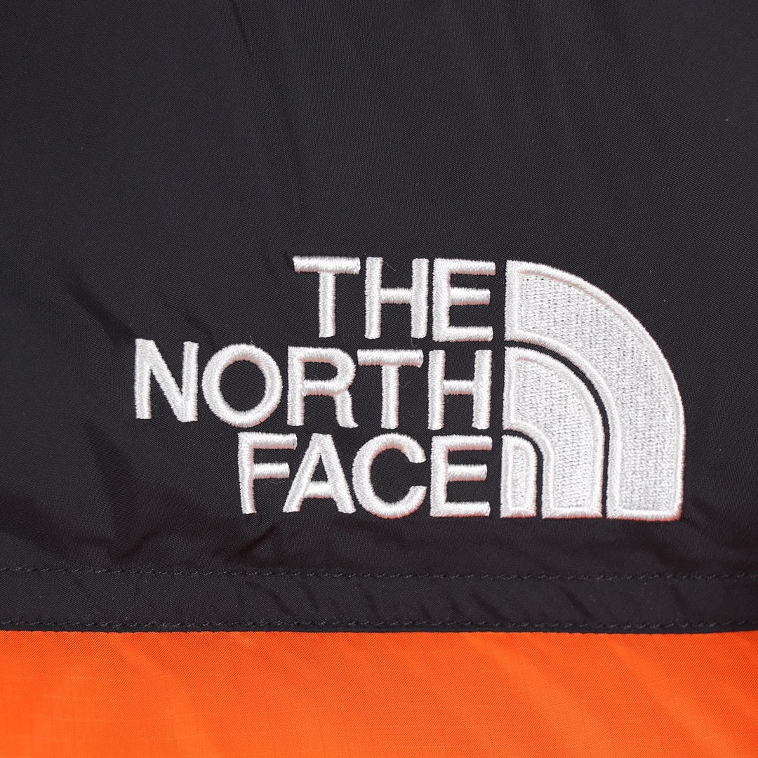 The North Face 1996 Retro Nuptse Orange Puffer Jacket for Cold Weather