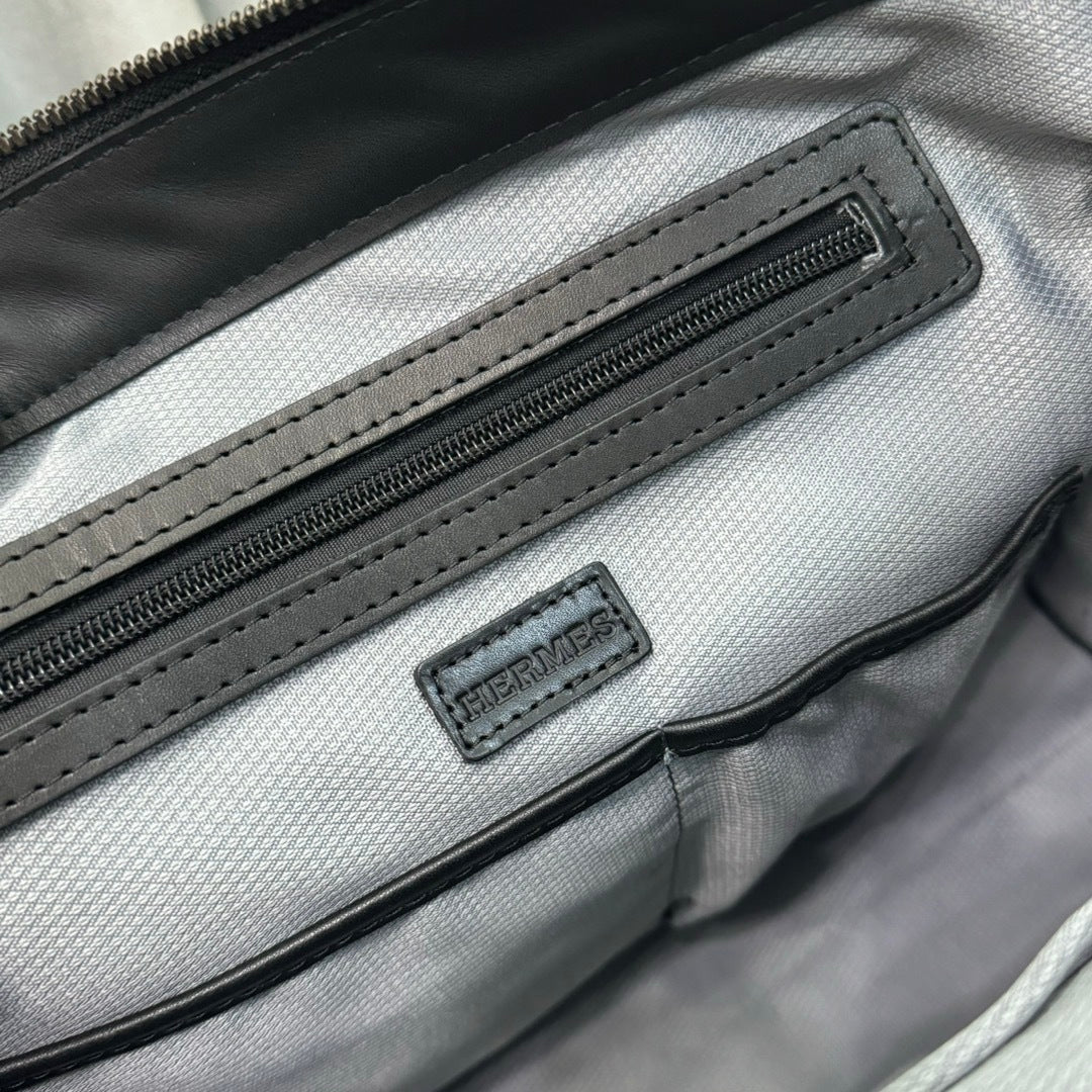 Hermès Black Canvas Briefcase With Leather Trim And Buckle Closure