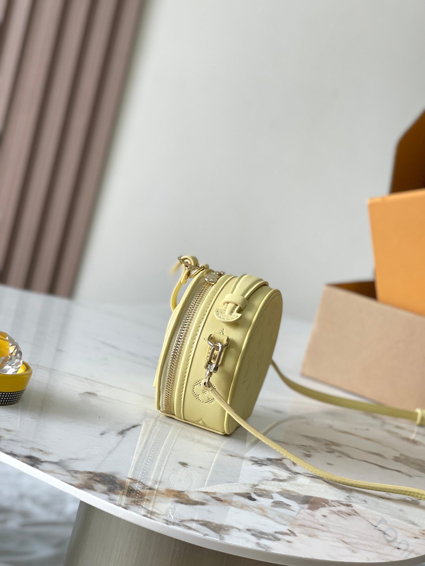 Chic Yellow LV Embossed Round Crossbody Bag With Adjustable Strap And Signature Details