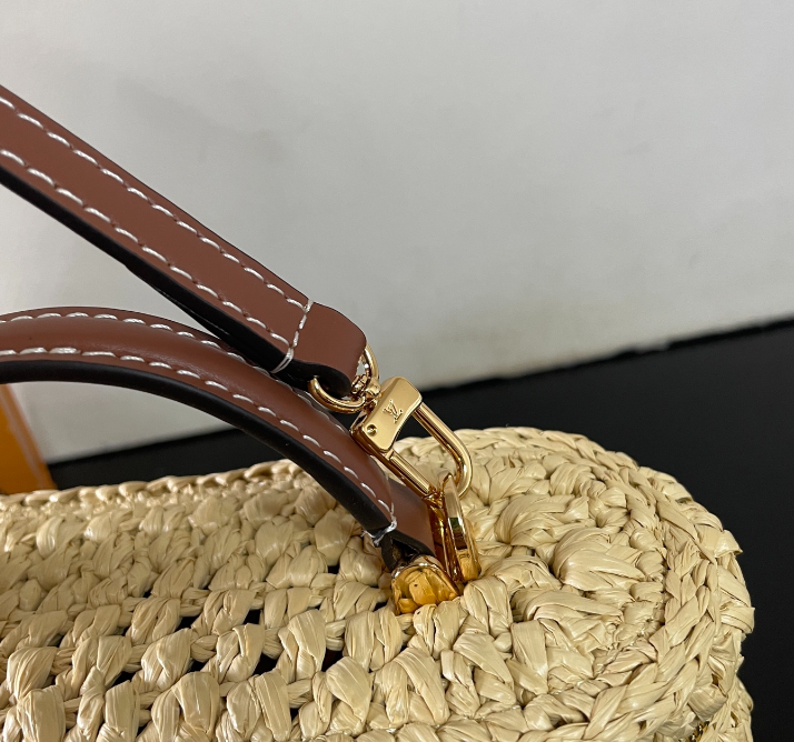 Chic Louis Vuitton Woven Straw Vanity Bag With Leather Handle And Lock Accents