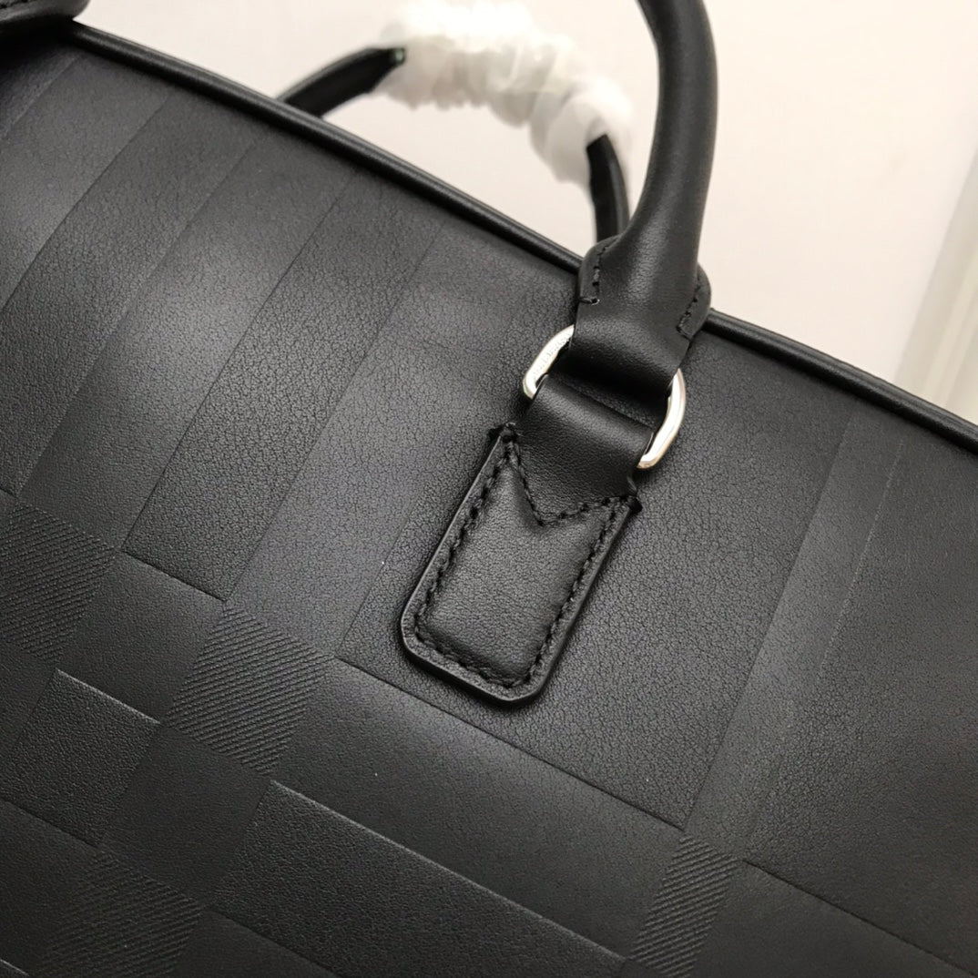 Sleek Black Burberry Briefcase With Woven Texture For Sophisticated Business And Travel Looks