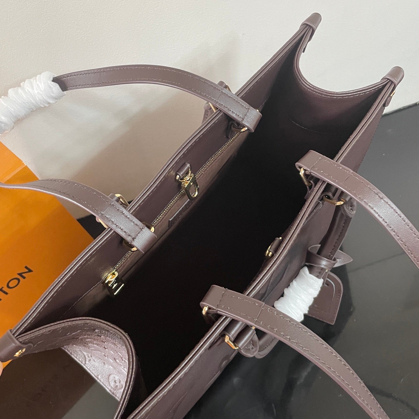 Elegant Louis Vuitton Gray Embossed Leather Tote Bag With Signature Monogram Patterns