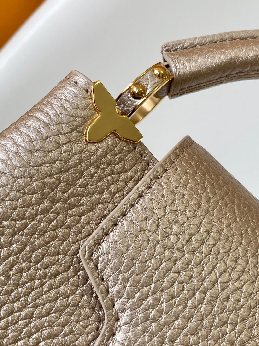Elegant Louis Vuitton Capucines Mini Bag in Beige Grained Leather with Gold Accents