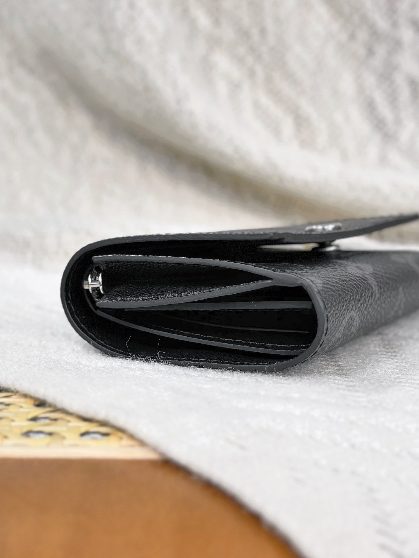 Stylish Louis Vuitton Black Monogram Wallet With Silver Button For Sophisticated Accessory M12598