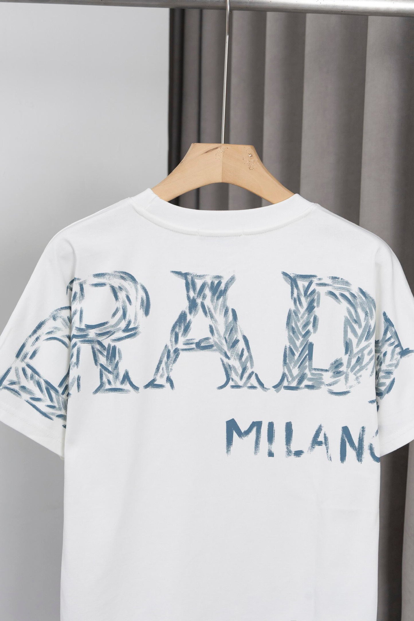Prada Black/White Tee With Iconic Triangle Logo For Sophisticated Streetwear Looks