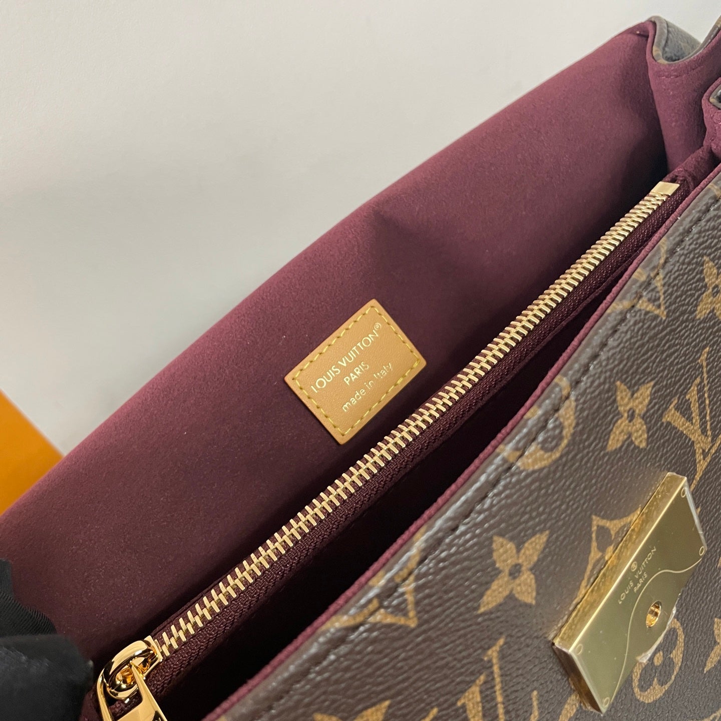 Classic Louis Vuitton Monogram Canvas Handbag With Lock Detail And Stylish Design