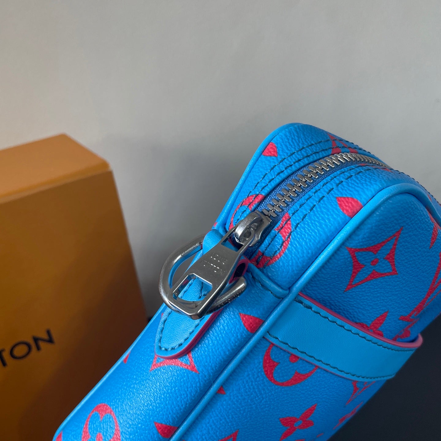 Eye Catching Blue Louis Vuitton Crossbody Bag With Red Monogram Pattern And Adjustable Strap