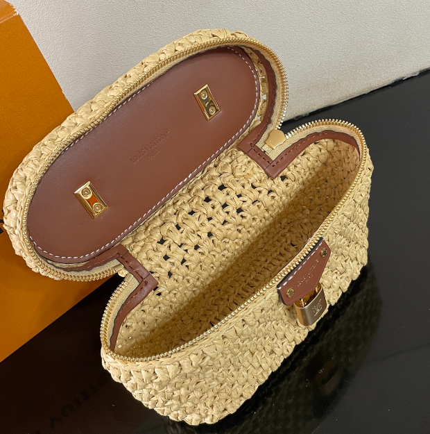 Chic Louis Vuitton Woven Straw Vanity Bag With Leather Handle And Lock Accents