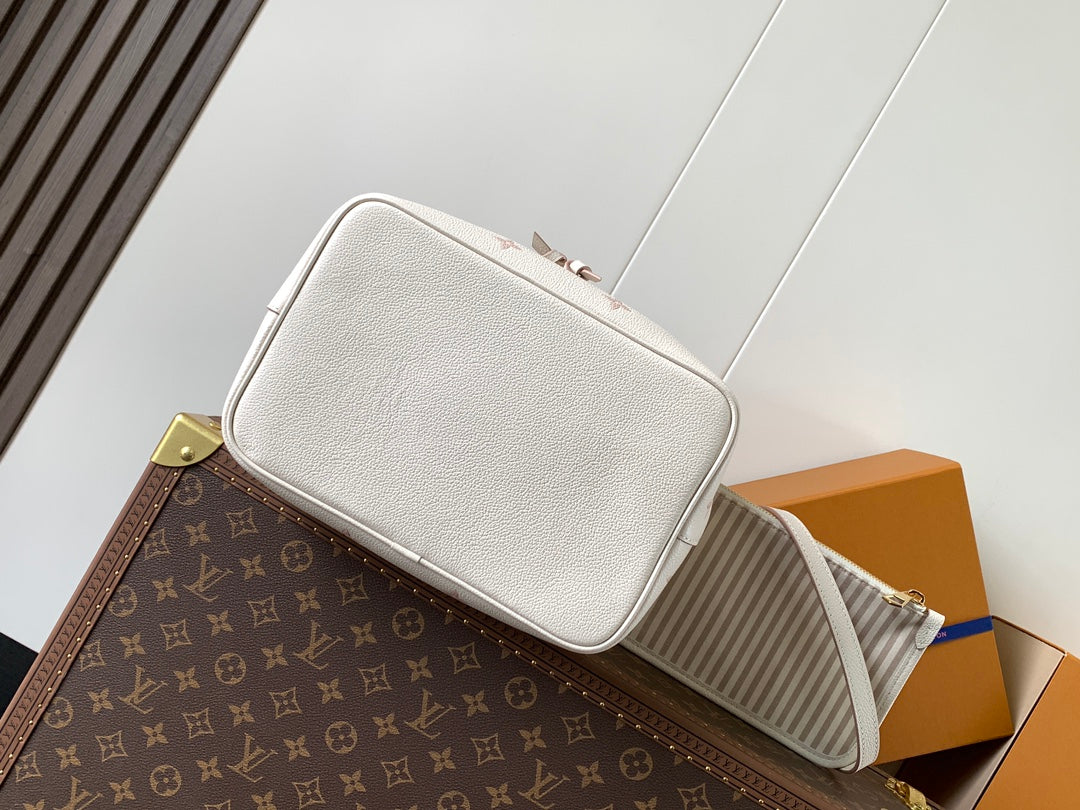 Chic Louis Vuitton White Monogram Empreinte Bucket Bag for Fashion - Forward Style