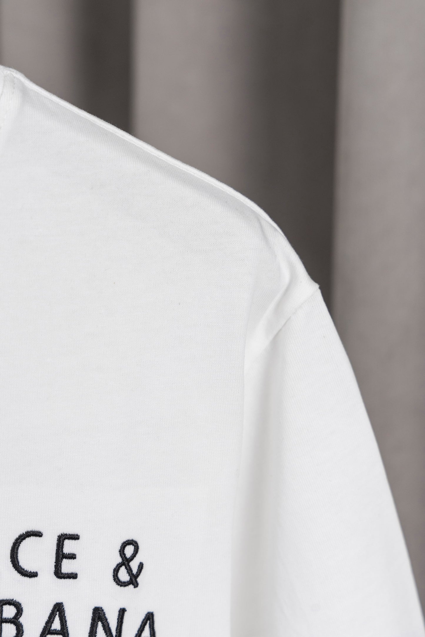 Elegant Dolce & Gabbana White/Black T - Shirt With Signature Branding For Fashion Enthusiasts