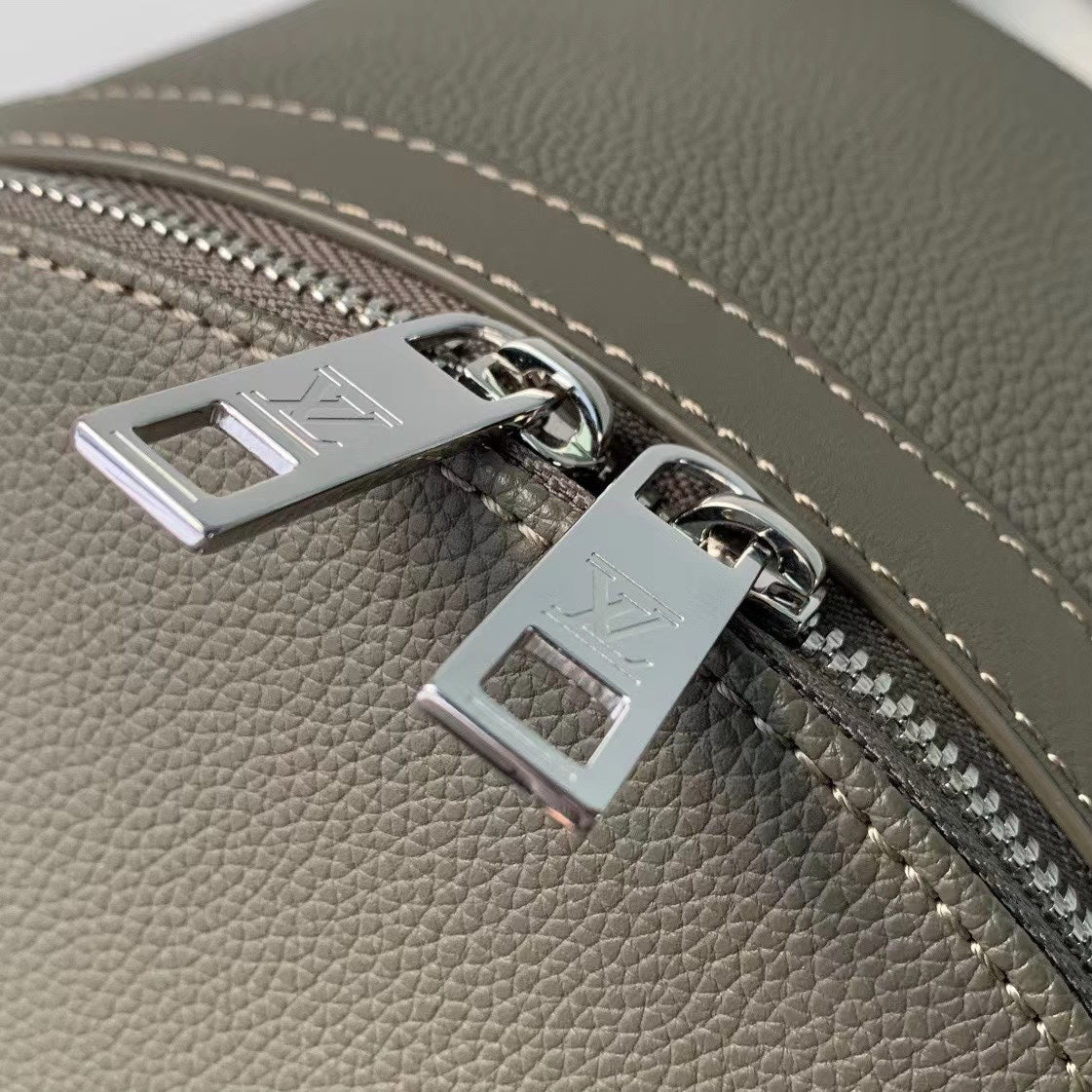 Sleek Gray Louis Vuitton Backpack Crafted From Premium Leather For Modern Style