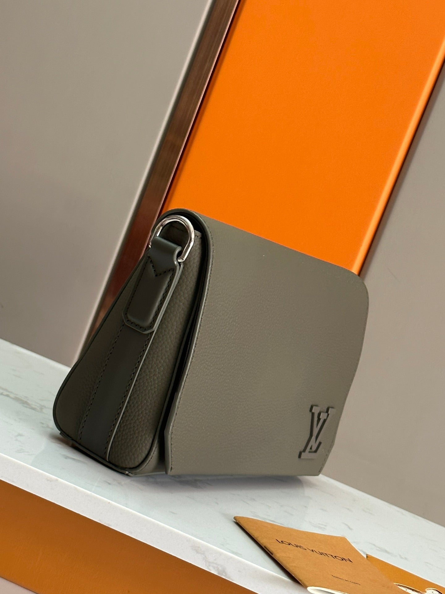 Elegant Louis Vuitton Gray Leather Crossbody Bag With Iconic LV Logo For Sophisticated Style M24769