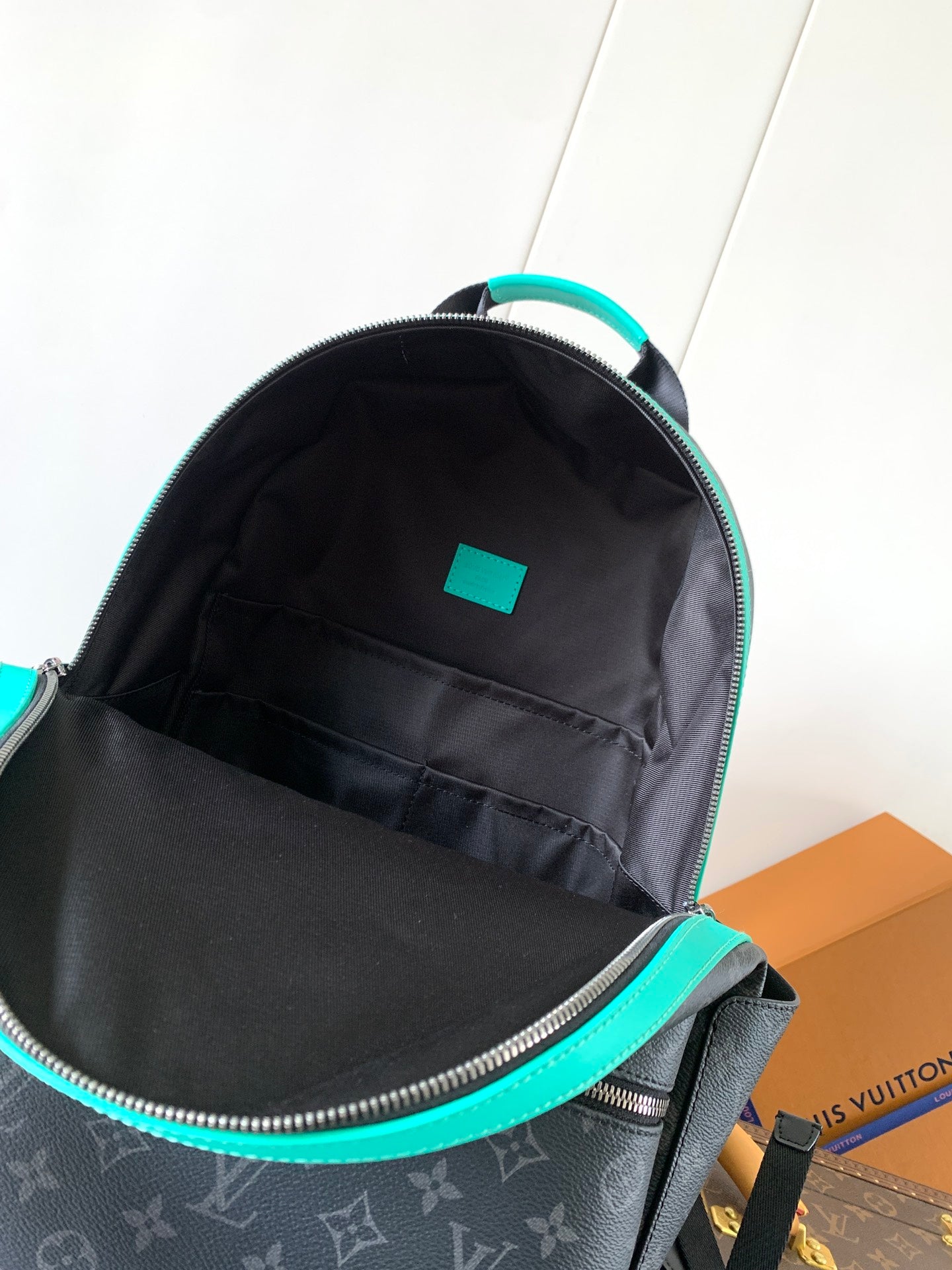 Stylish Louis Vuitton Monogram Backpack With Turquoise Accents And Functional Design