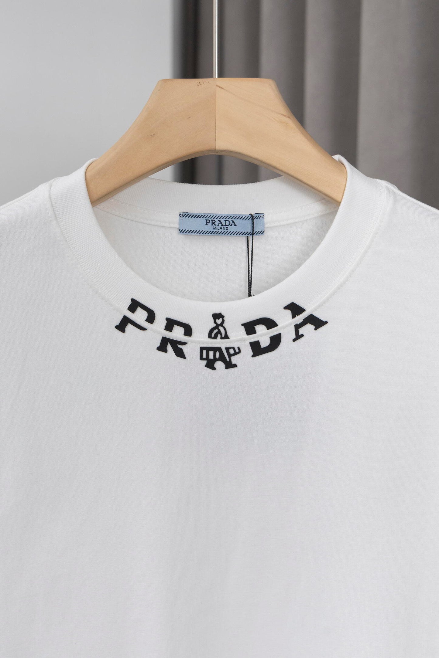Prada Black/White Tee With Signature Logo Detailing For Luxury Fashion Lovers