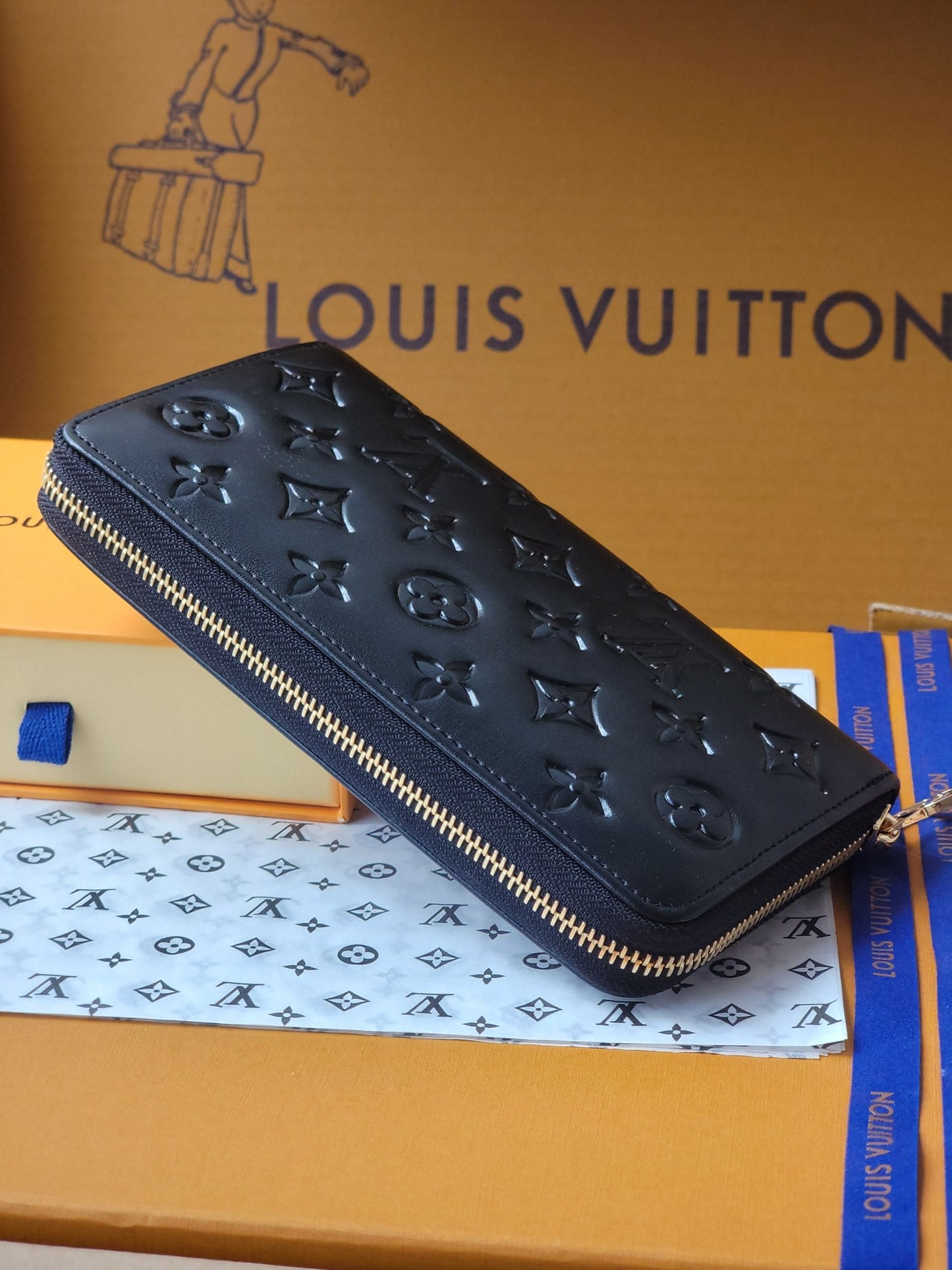 Elegant Louis Vuitton Black Embossed Leather Zip Around Wallet With Gold Accents