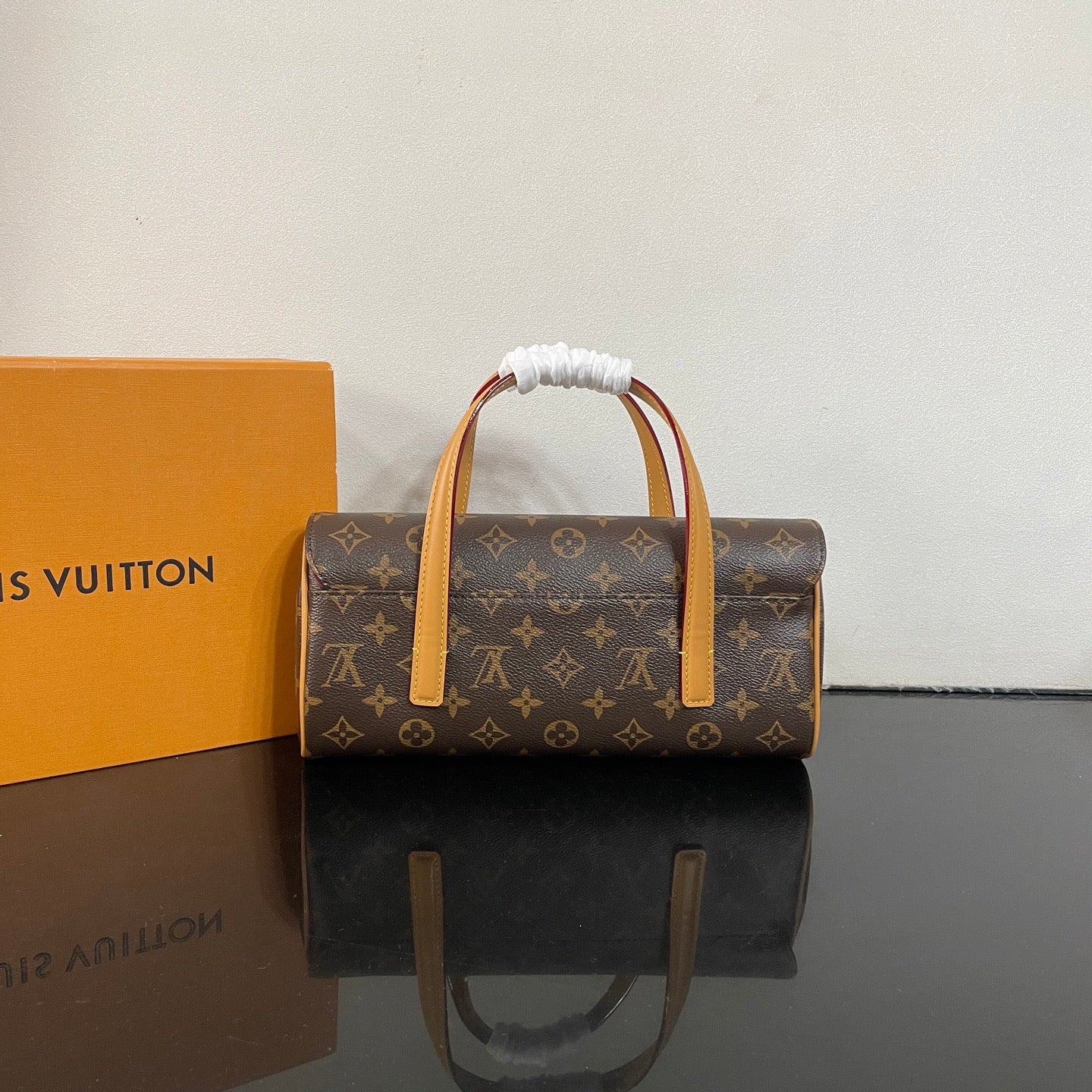 Classic Louis Vuitton Monogram Cylinder Handbag With Leather Handles And Timeless Design