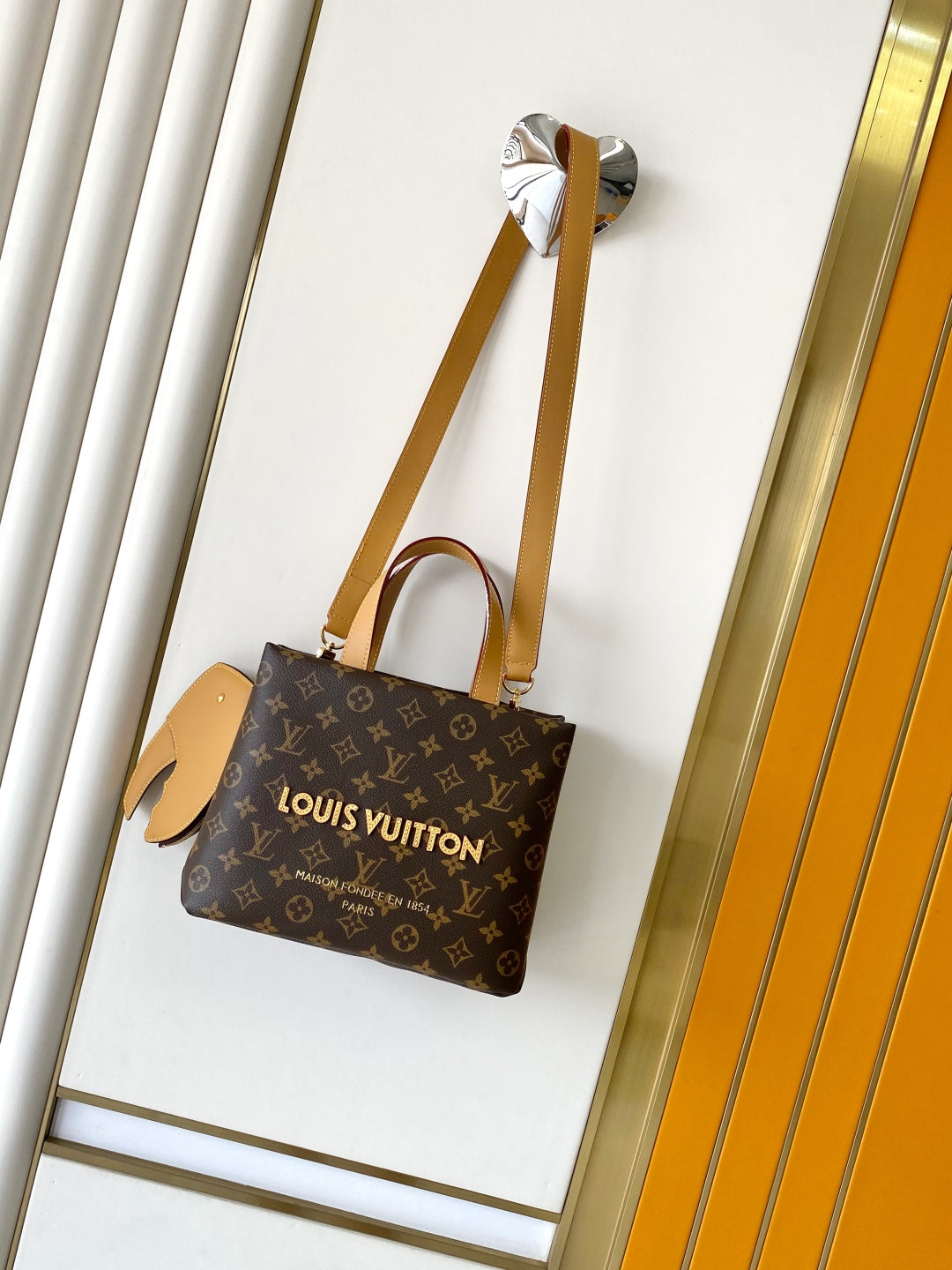 Elegant Louis Vuitton Monogram Canvas Tote Bag With Leather Handles And Gold Branding