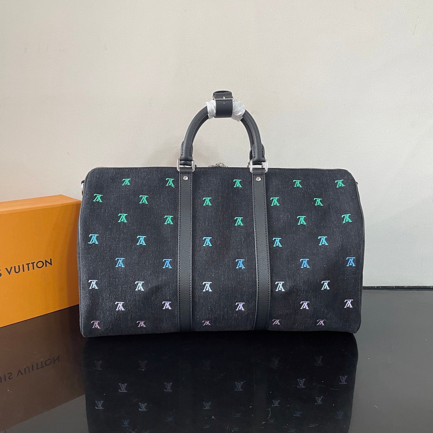 Luxury Black Travel Duffel Bag with Colorful LV Monogram for Stylish Weekend Getaways