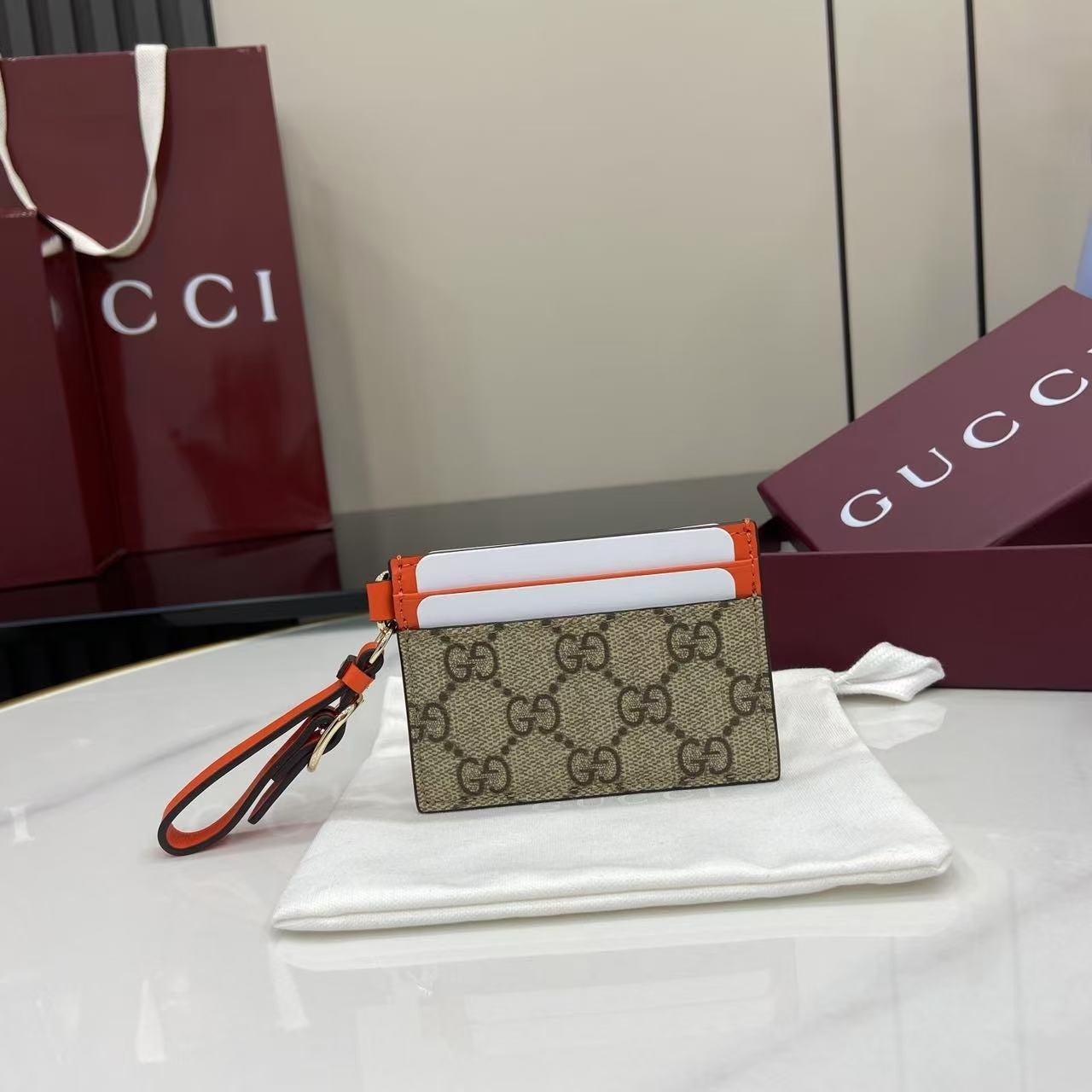 Chic Gucci Card Holder With Signature GG Pattern Orange Accents And Wrist Strap 819121