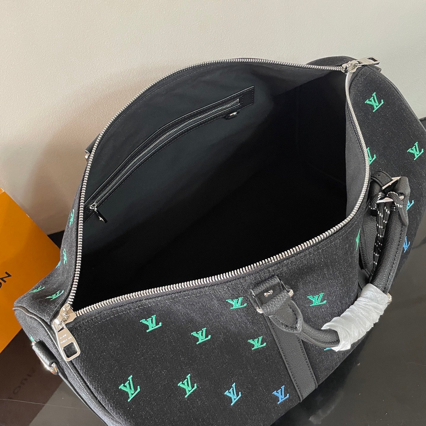 Luxury Black Travel Duffel Bag with Colorful LV Monogram for Stylish Weekend Getaways