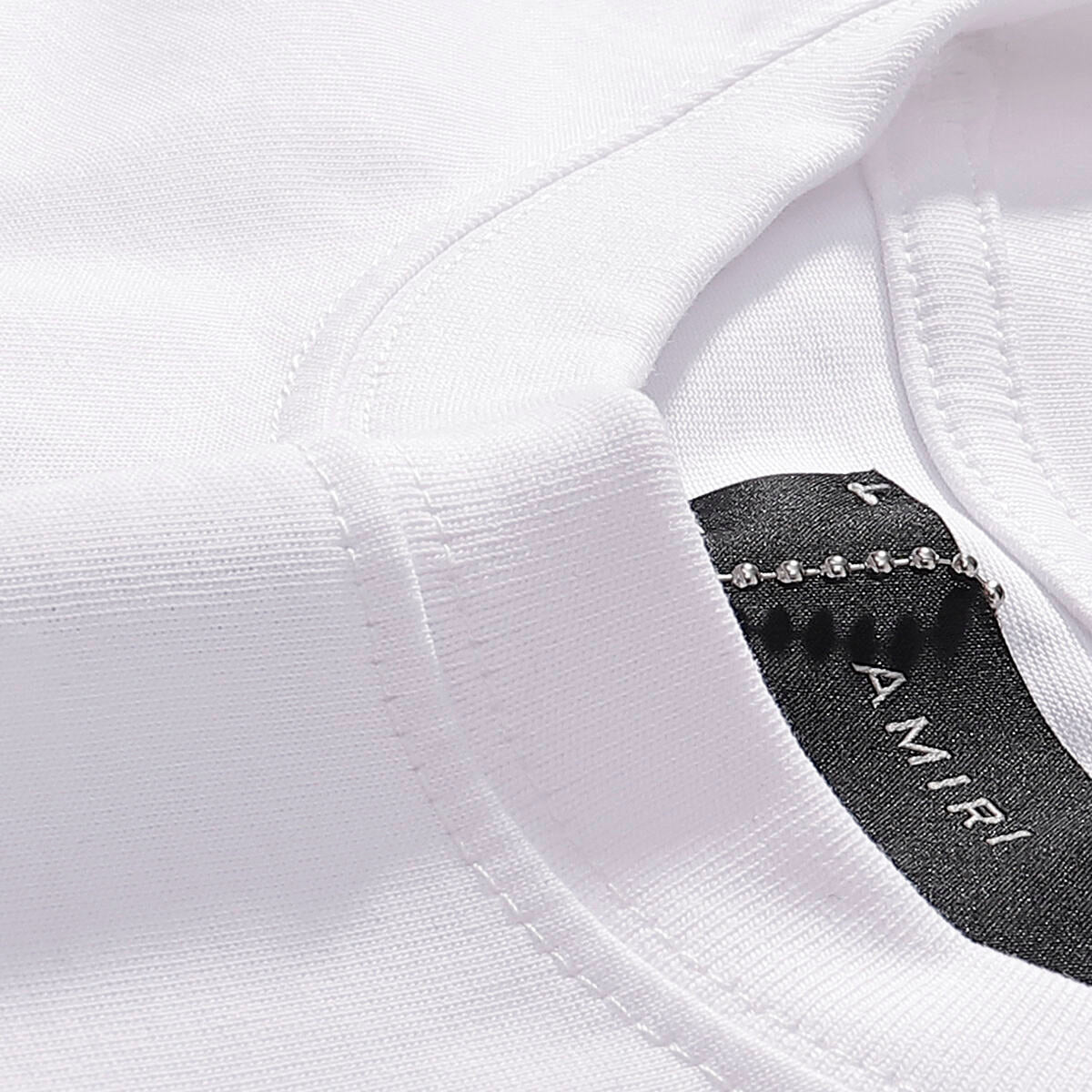 AMIRI Black/White Tee With “I AM what I AM” Slogan For Bold Streetwear Statements