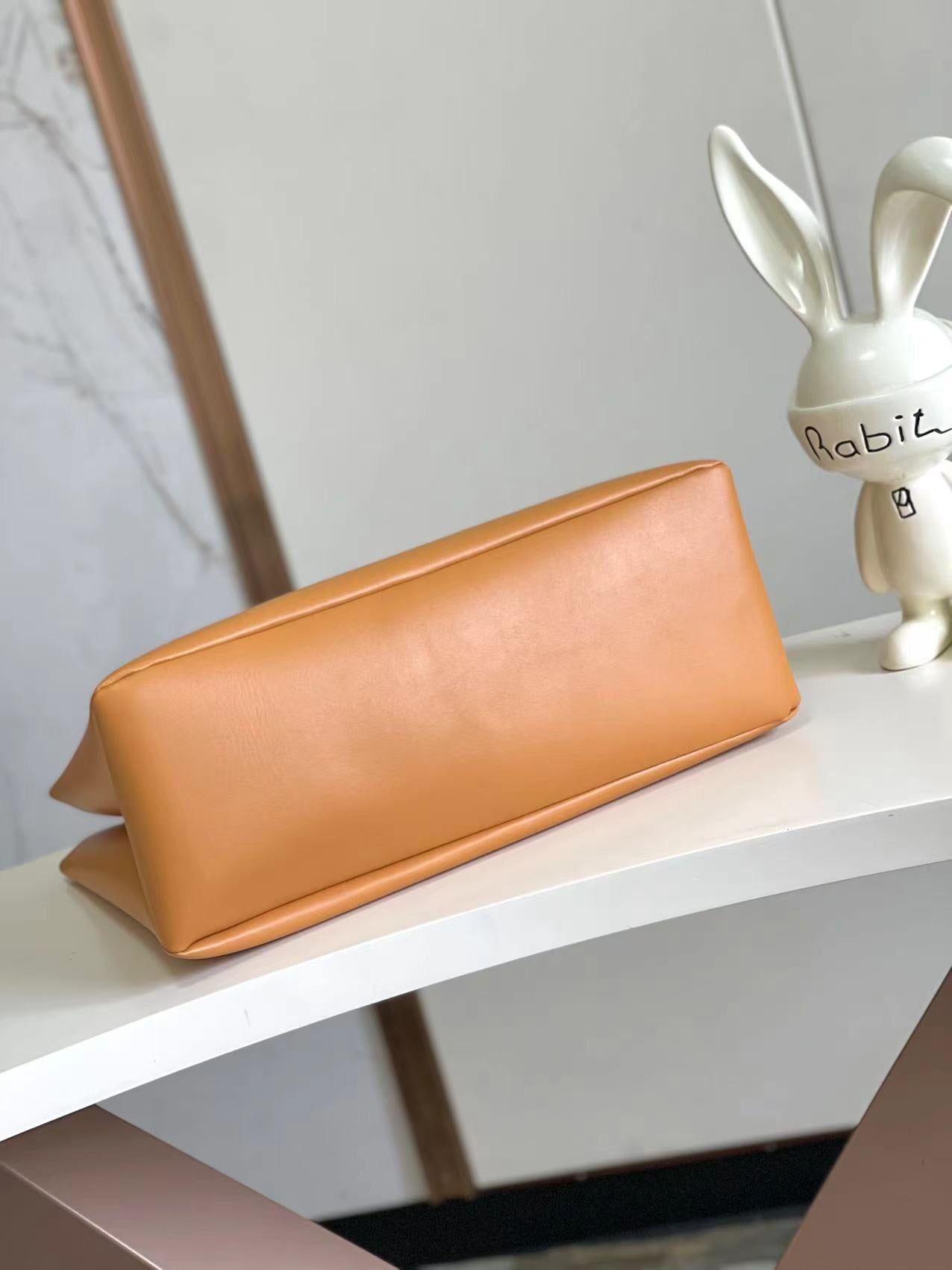 Stylish Orange Louis Vuitton Tote Bag With Blue Handles And Branding