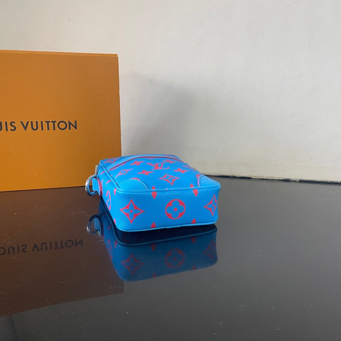 Eye Catching Blue Louis Vuitton Crossbody Bag With Red Monogram Pattern And Adjustable Strap