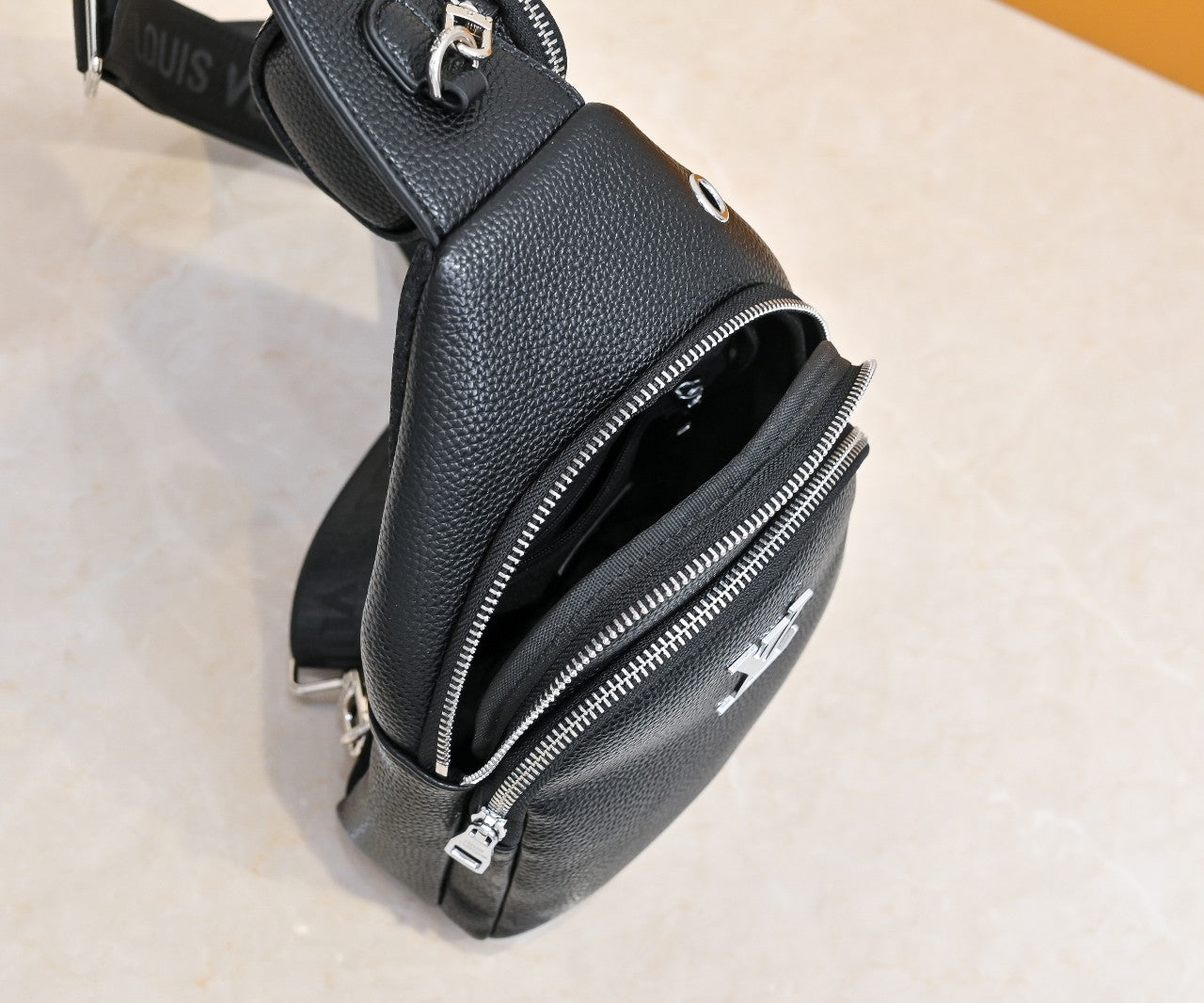 Luxury Louis Vuitton Black Leather Sling Bag with Signature Logo and Stylish Design