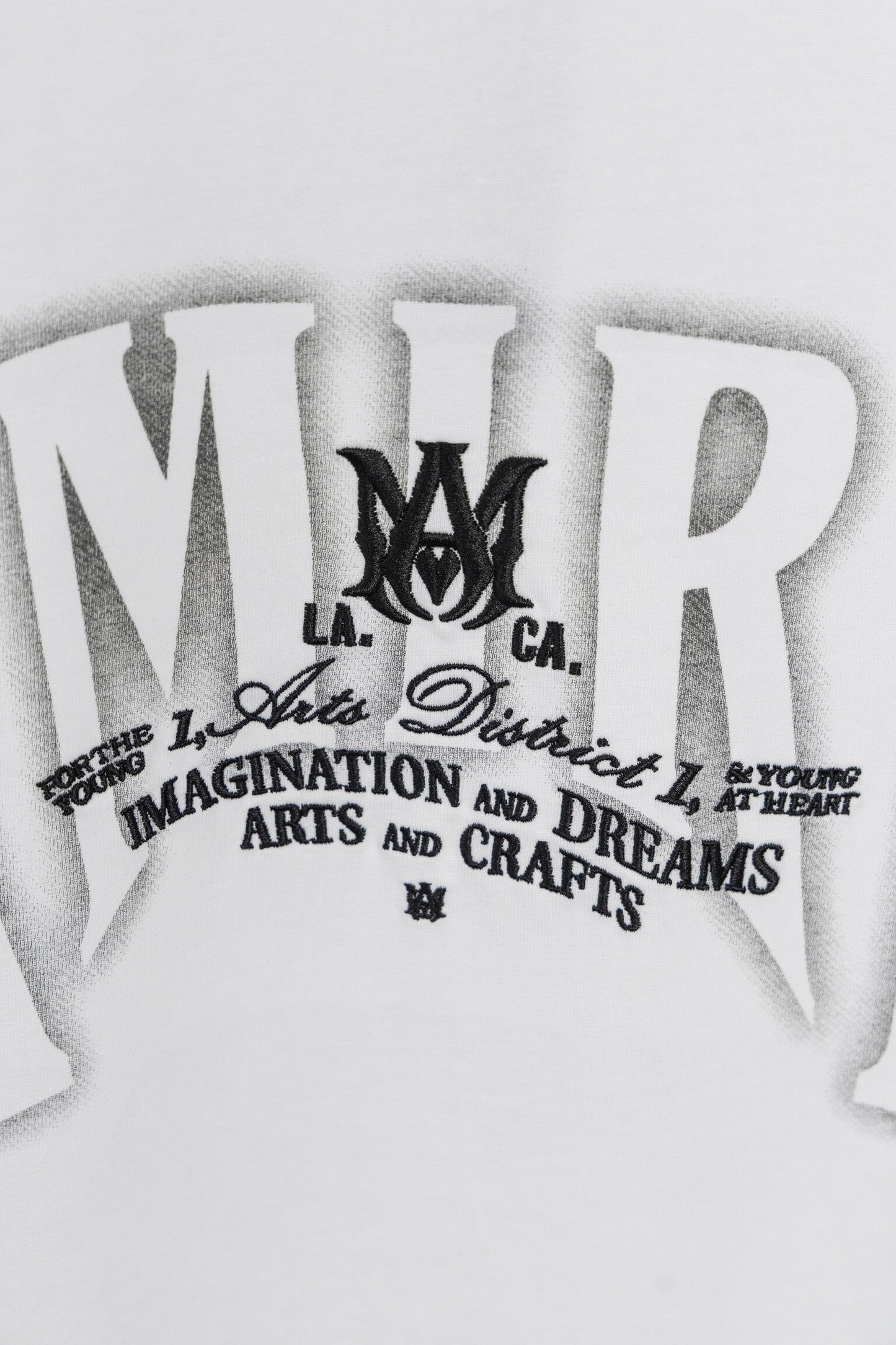 AMIRI White/Black Graphic Tee With Bold Logo For Trendy Streetwear Enthusiasts