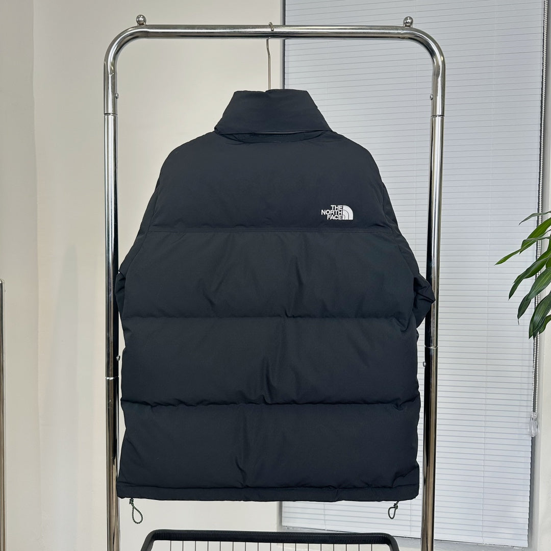 The North Face Black Nuptse Puffer Jacket With Iconic Branding And Warmth