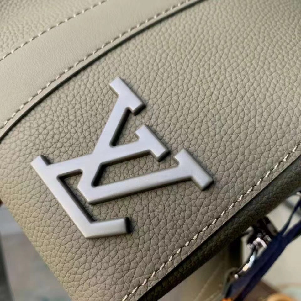 Chic Olive Green Louis Vuitton Crossbody Bag With Textured Leather And Signature Details