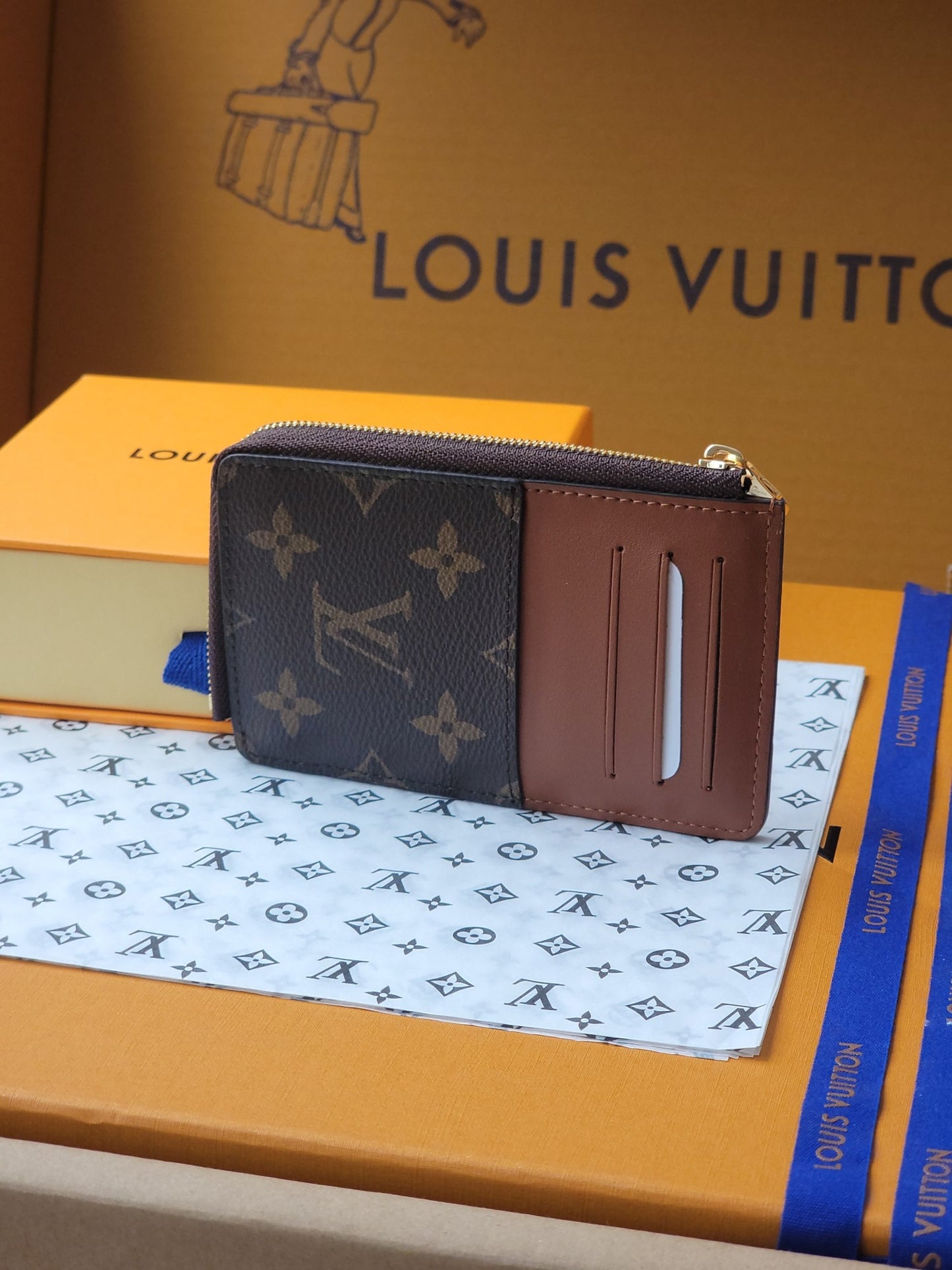 Chic Louis Vuitton Monogram Card Holder With Brown Accents And Gold Zipper M80556