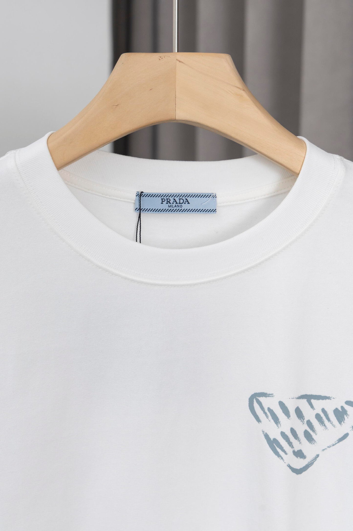 Prada Black/White Tee With Iconic Triangle Logo For Sophisticated Streetwear Looks