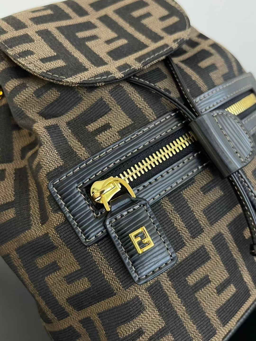 Elegant Fendi Mini Backpack With Iconic FF Pattern And Gold - Tone Hardware 185