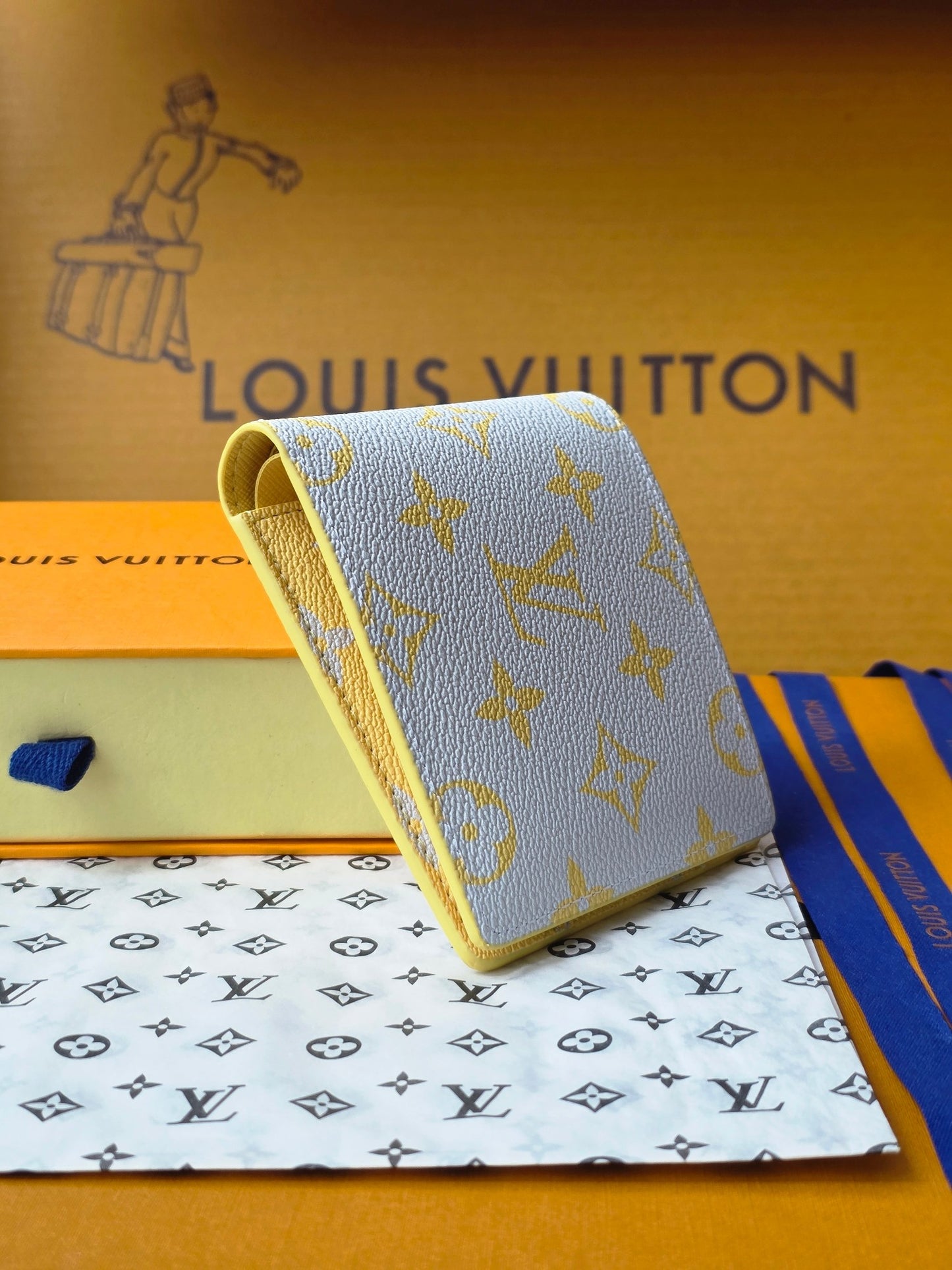 Elegant Louis Vuitton Light Blue Wallet With Gold Monogram And Sparkling Accents M14694