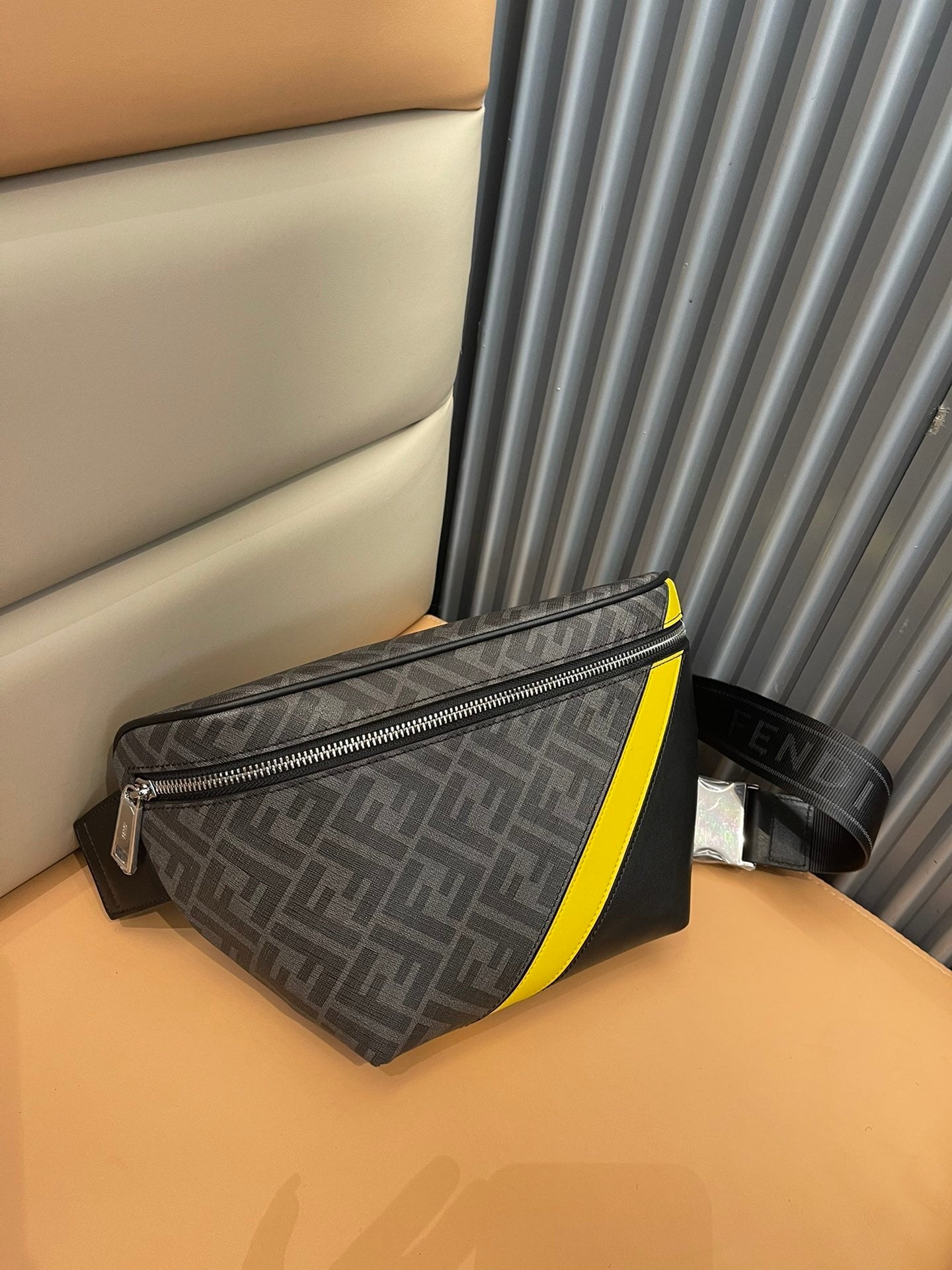 Stylish Fendi Belt Bag With Iconic FF Pattern And Bold Yellow Branding 7vA562