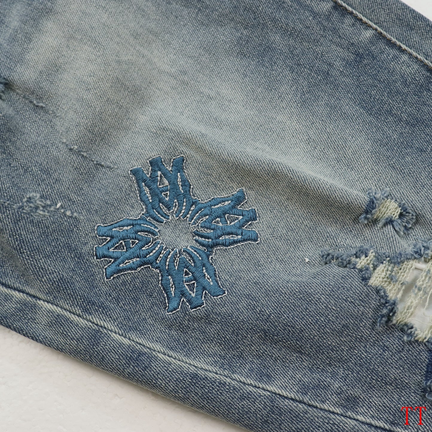 Amiri Light Blue Distressed Jeans With Colorful Embroidered Patterns